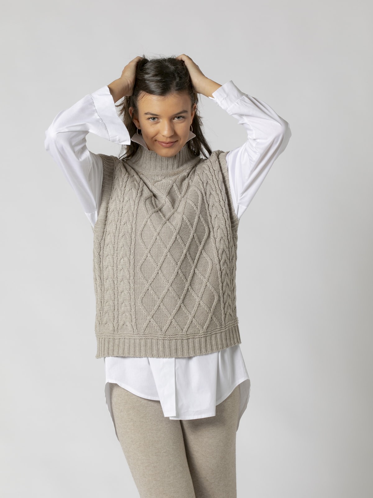 Woman Knitted waistcoat with high neck Stone