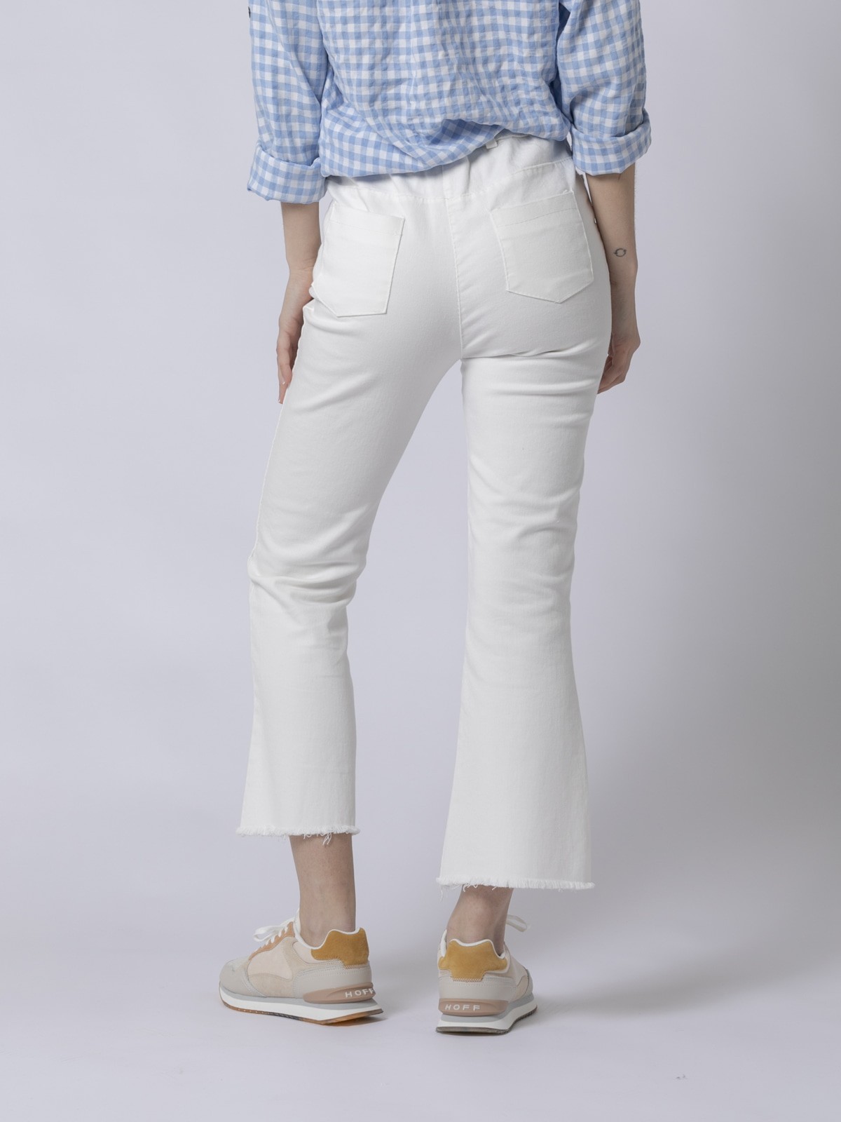 Pantalón tobillero elástico de mujer blanco con ribete plateado de Golftini