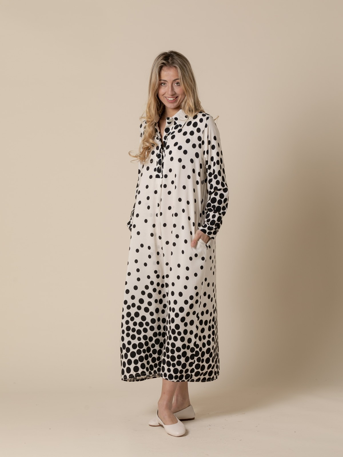 Woman long flowing dress with black flecks and  White