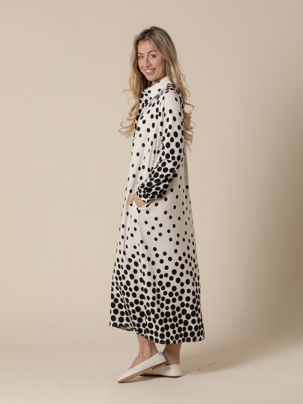 Woman long flowing dress with black flecks and  White