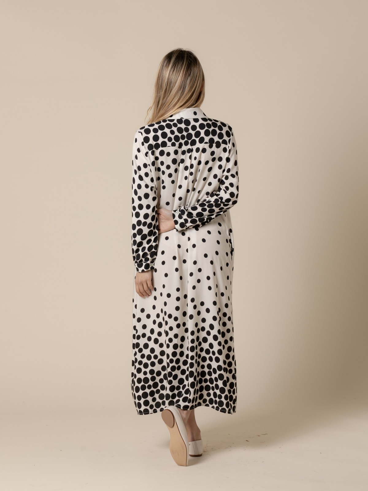 Woman long flowing dress with black flecks and  White