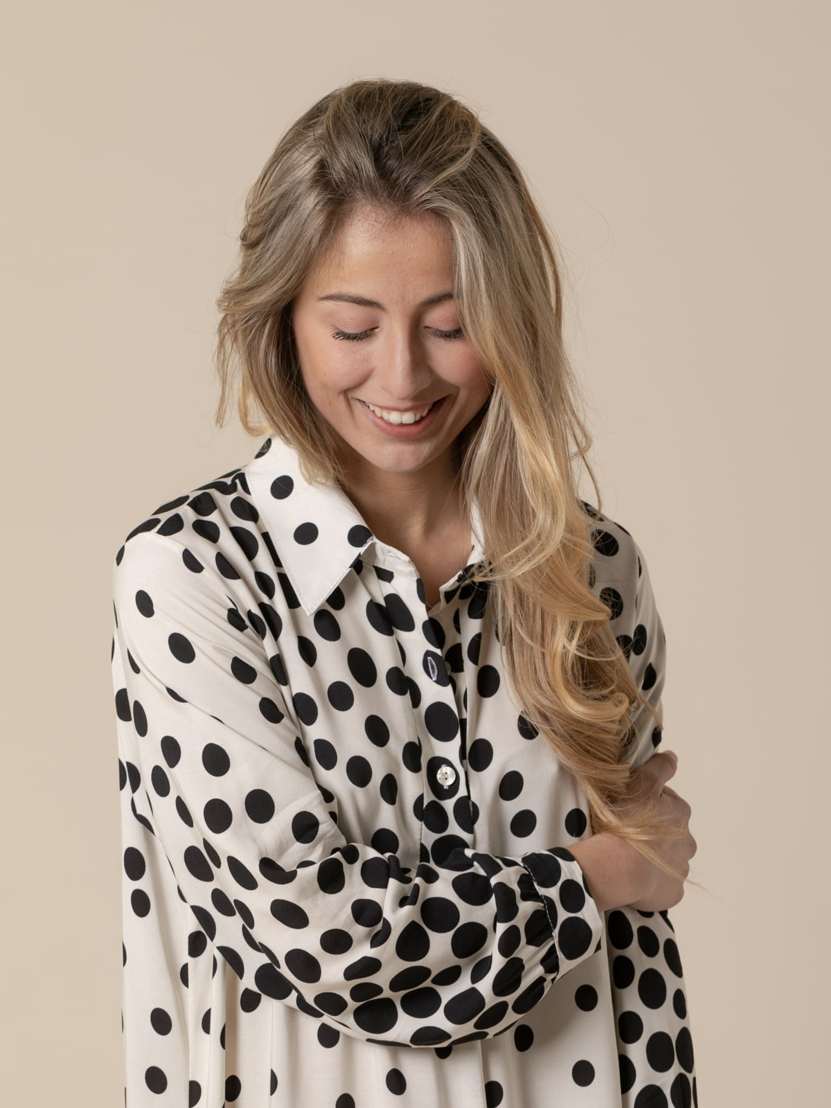 Woman long flowing dress with black flecks and  White