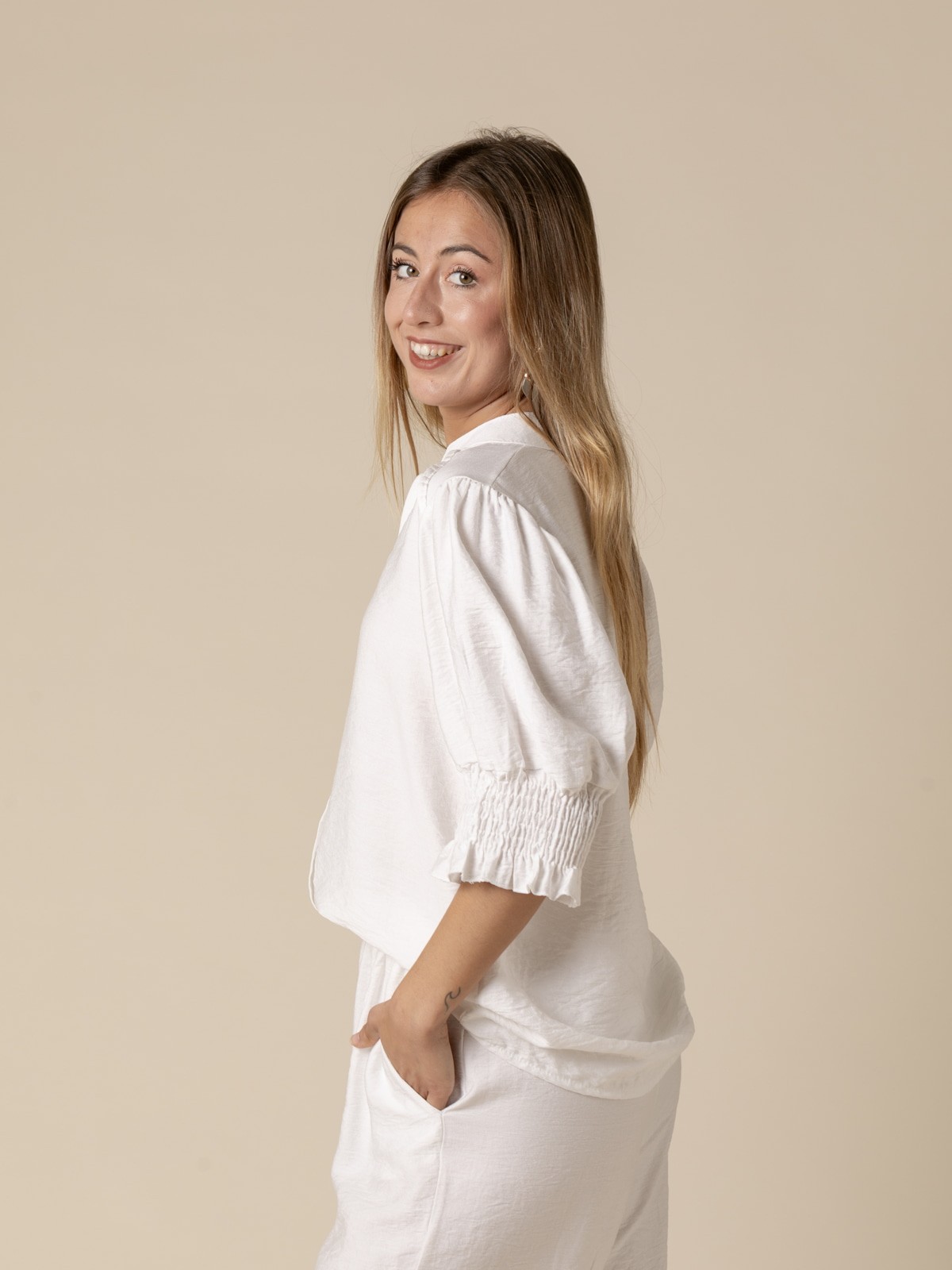 Woman High V-neck shirt with elastic sleeves  Whitecolour