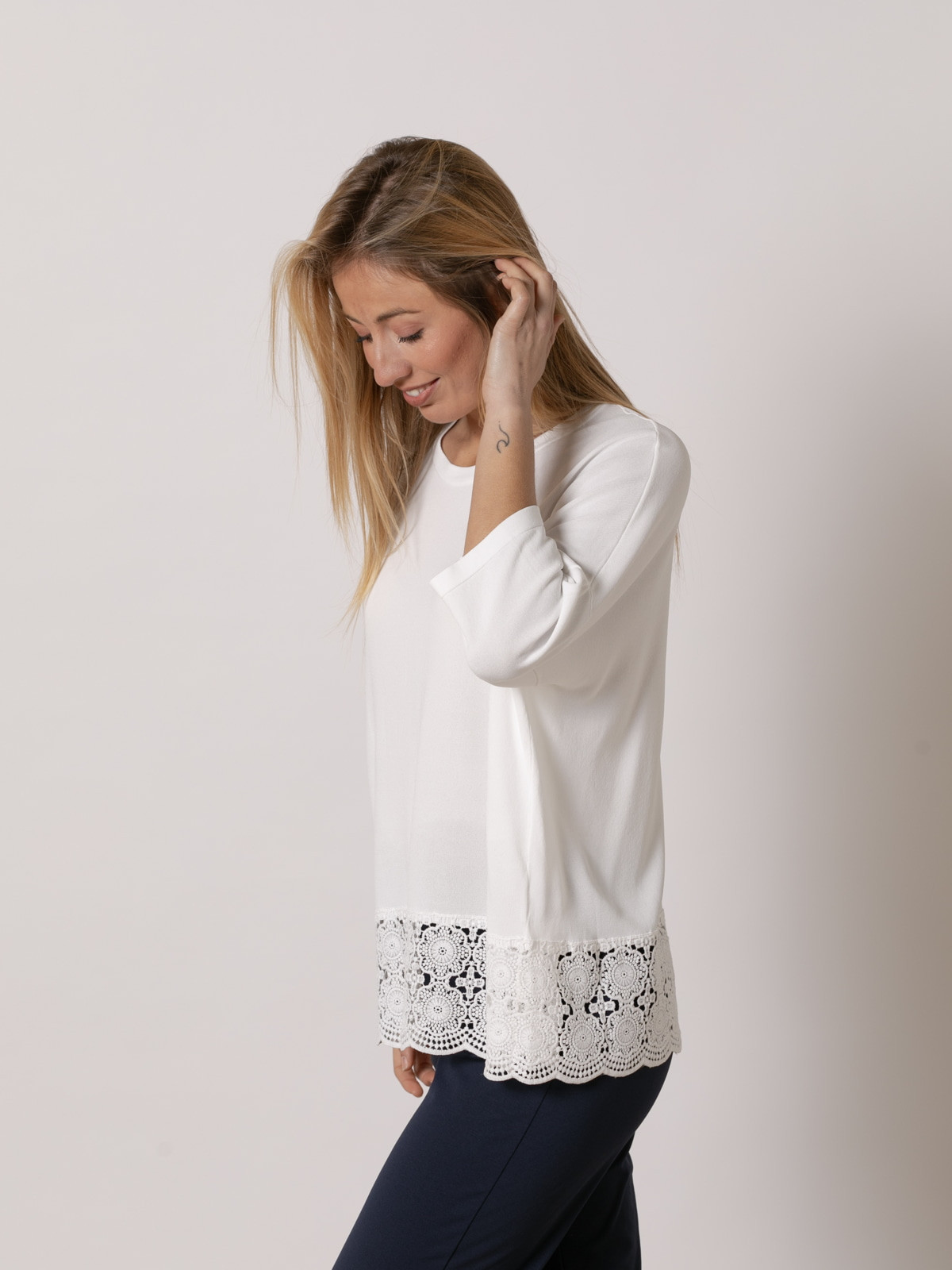 Flowing jersey with detail at the bottom  White colour