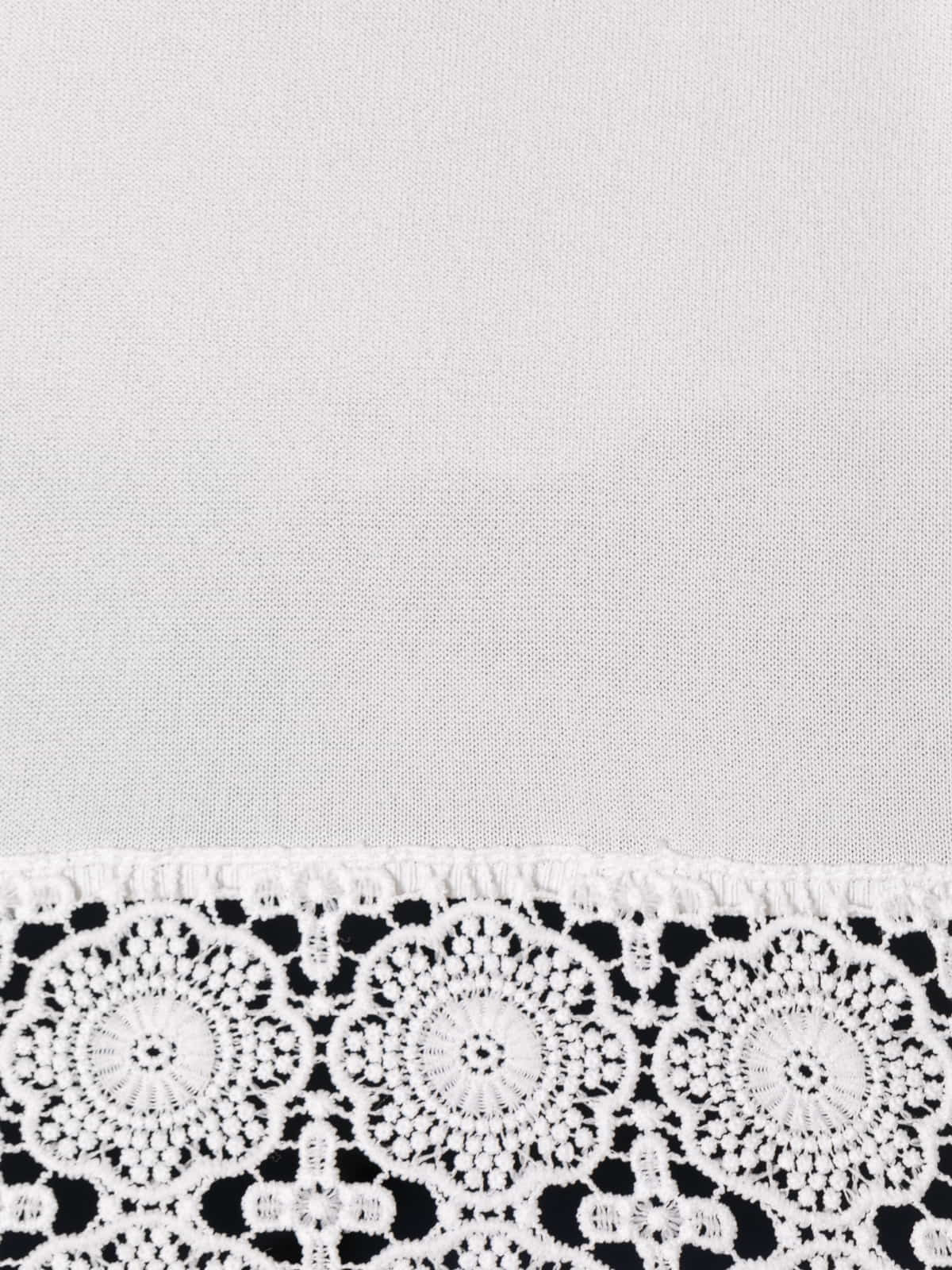 Flowing jersey with detail at the bottom  White colour